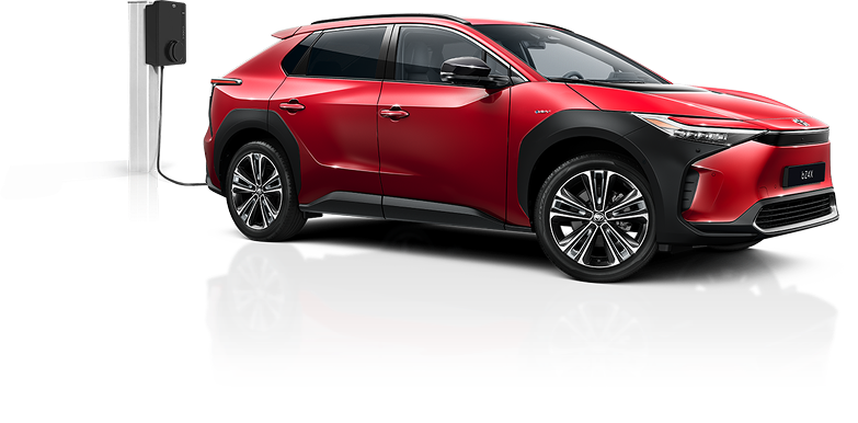 Ein roter Toyota C-HR Plug-in, der über eine Ladesäule geladen wird.